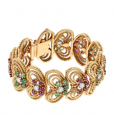 Rubies, emeralds, diamonds and gold bracelet. Circa 1920.