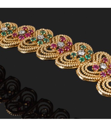 Rubies, emeralds, diamonds and gold bracelet. Circa 1920.